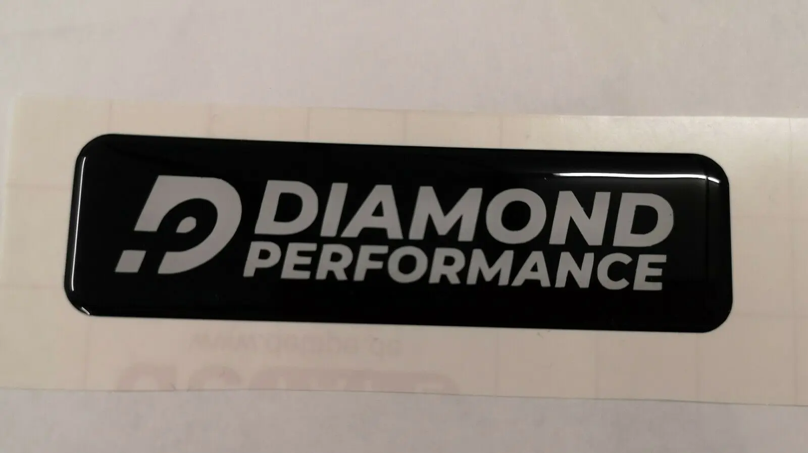 Diamond Performance logo domed sticker in white writing
